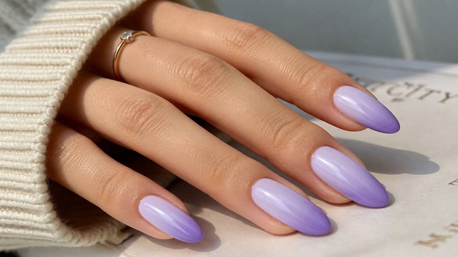 Ombre light purple nails fading from pale lilac to deeper lavender