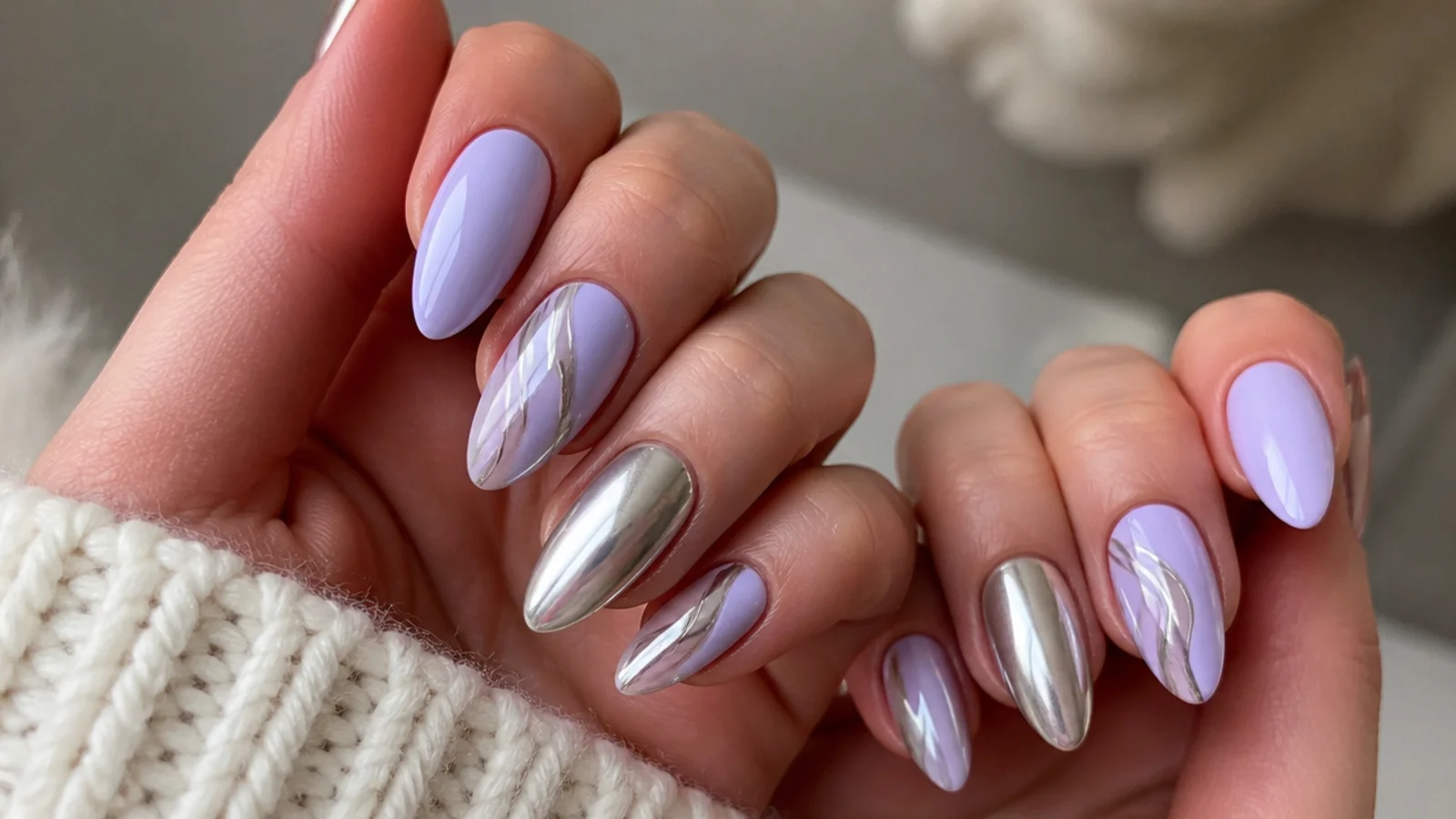 Light purple nails with silver chrome accent nails and fine lines