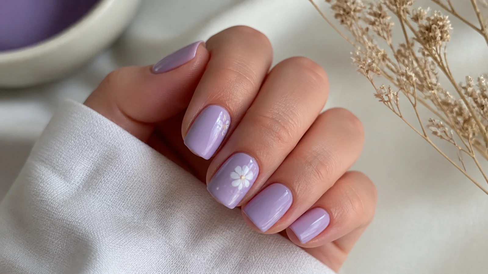Short squoval light purple nails in a soft everyday lilac