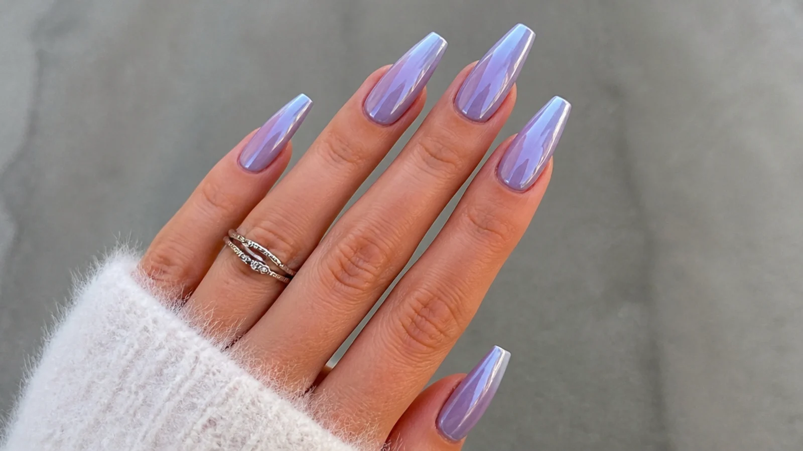 Reflective lilac chrome ombre nails fading to silver on a coffin shape