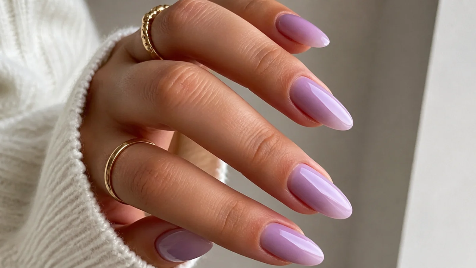 Soft milky lilac almond prom nails with a sheer glossy finish