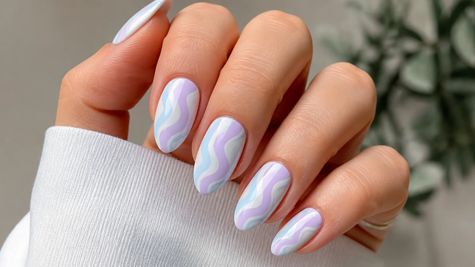 Pastel swirls of light blue and light purple on a white base
