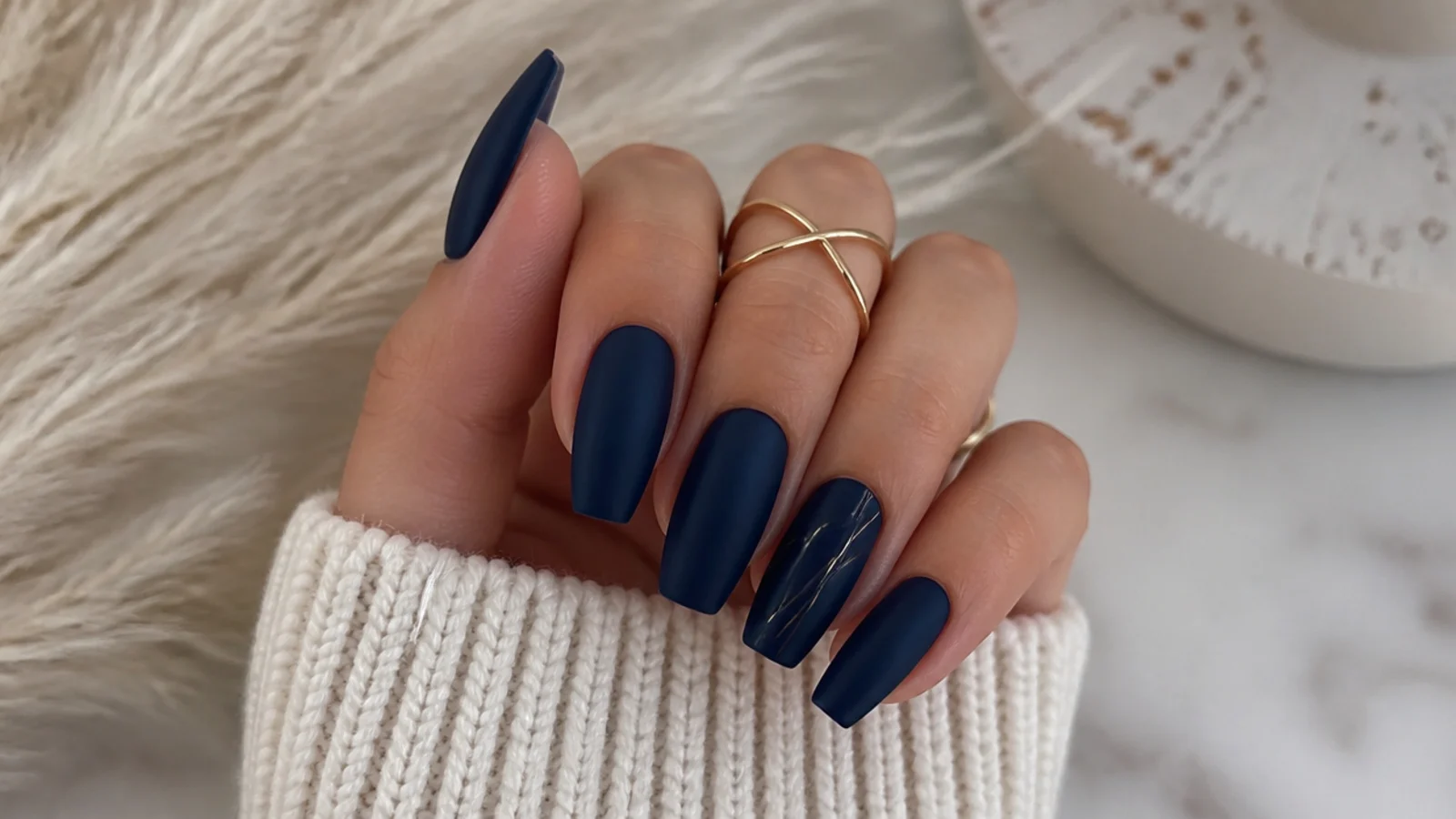 Deep matte navy blue nails on a coffin shape