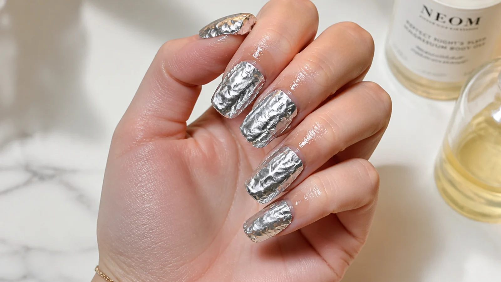 Cuticle oil applied around the skin and acetone foils for gel removal
