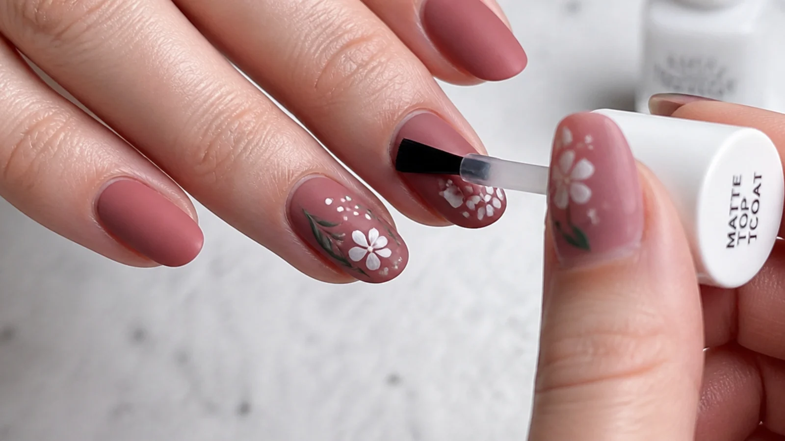 A matte top coat being brushed over cured color for a velvety finish