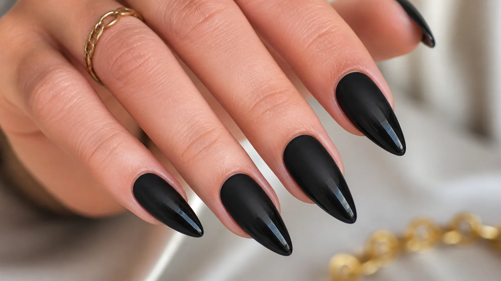 Matte black nails fading from matte base to glossy tips
