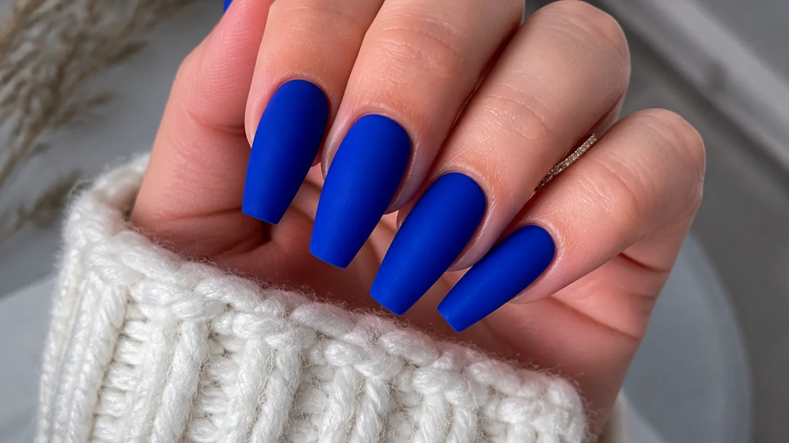 Bright matte cobalt blue nails on medium-length coffin nails