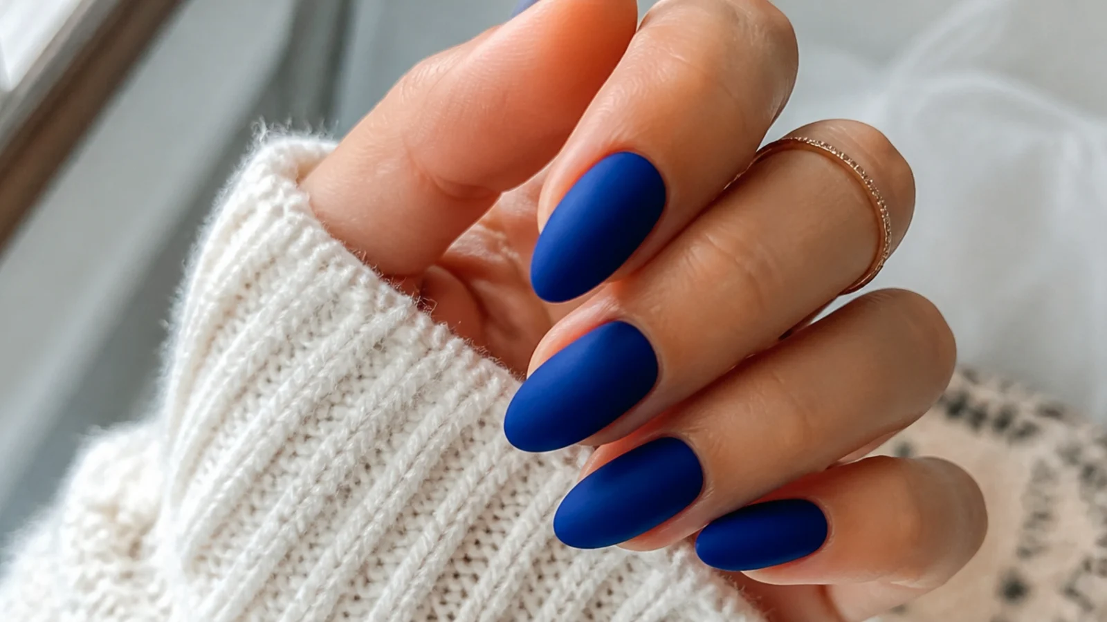 Rich matte royal blue nails on medium almond shape