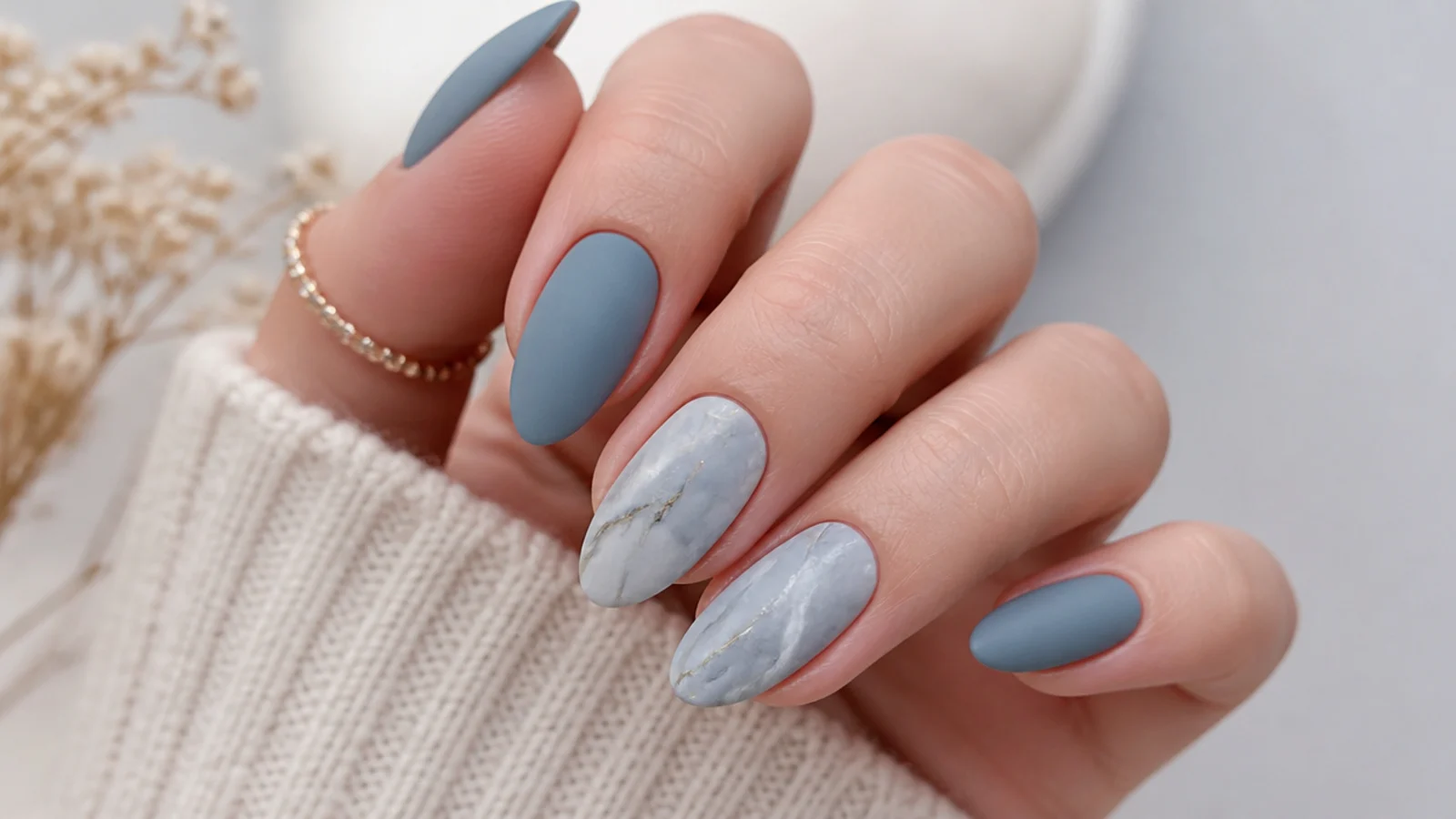 Matte dusty blue and gray marble nails with soft veining
