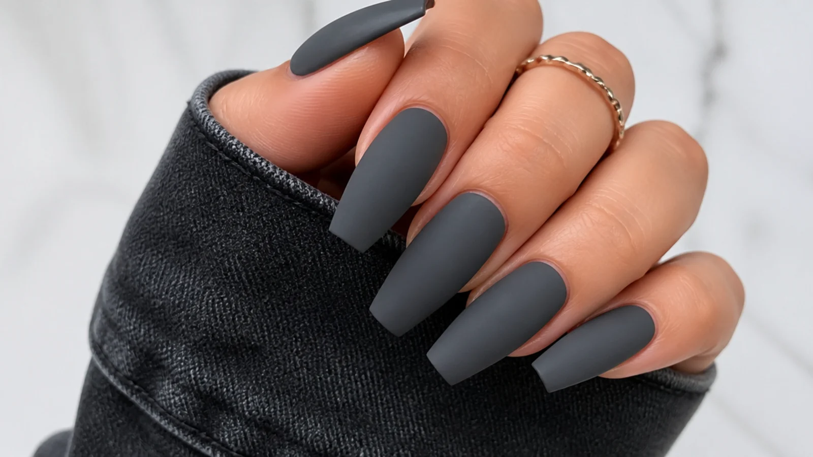 Deep matte charcoal gray coffin nails with a suede finish
