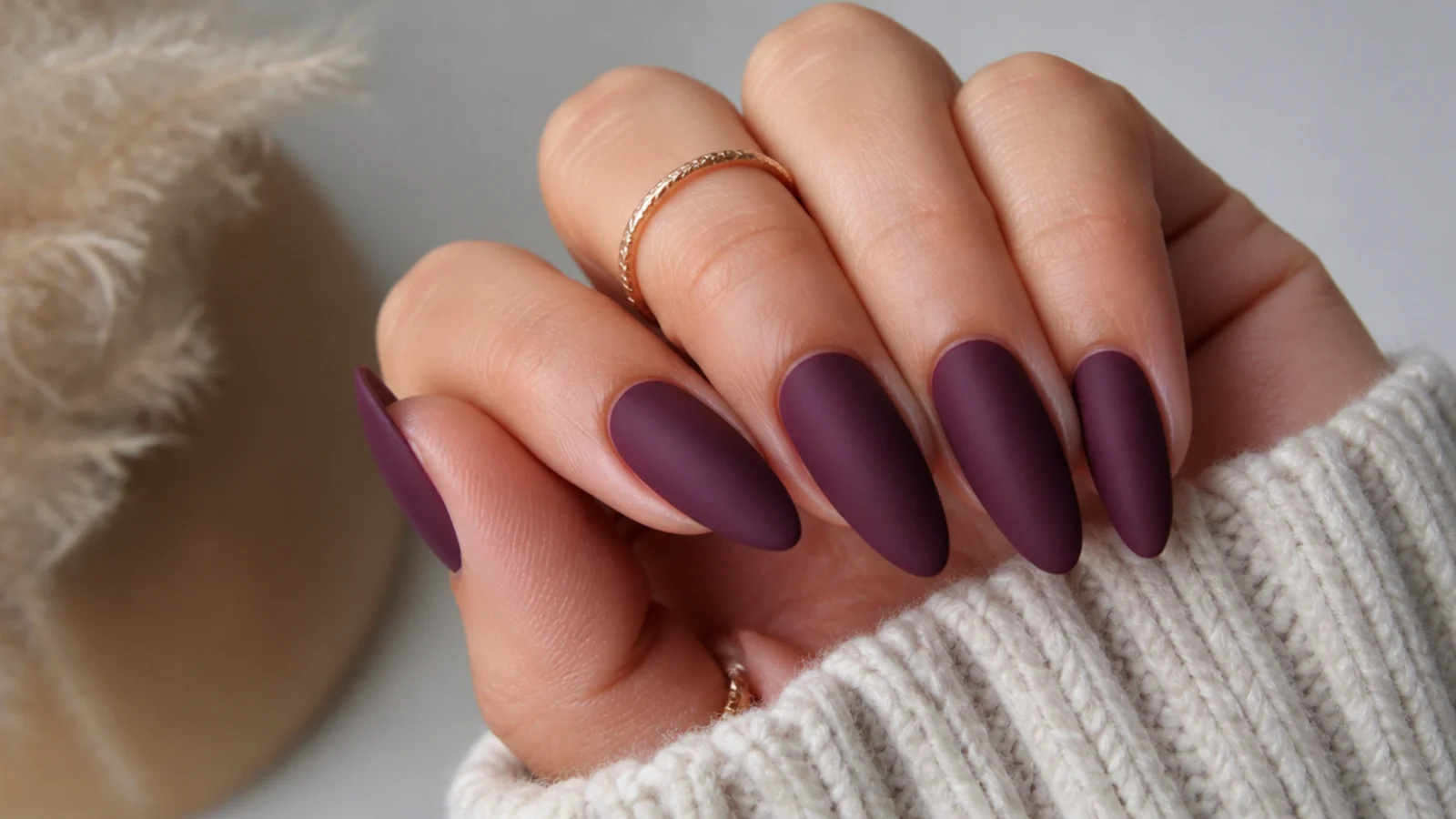 Deep matte plum purple almond nails with a velvety finish
