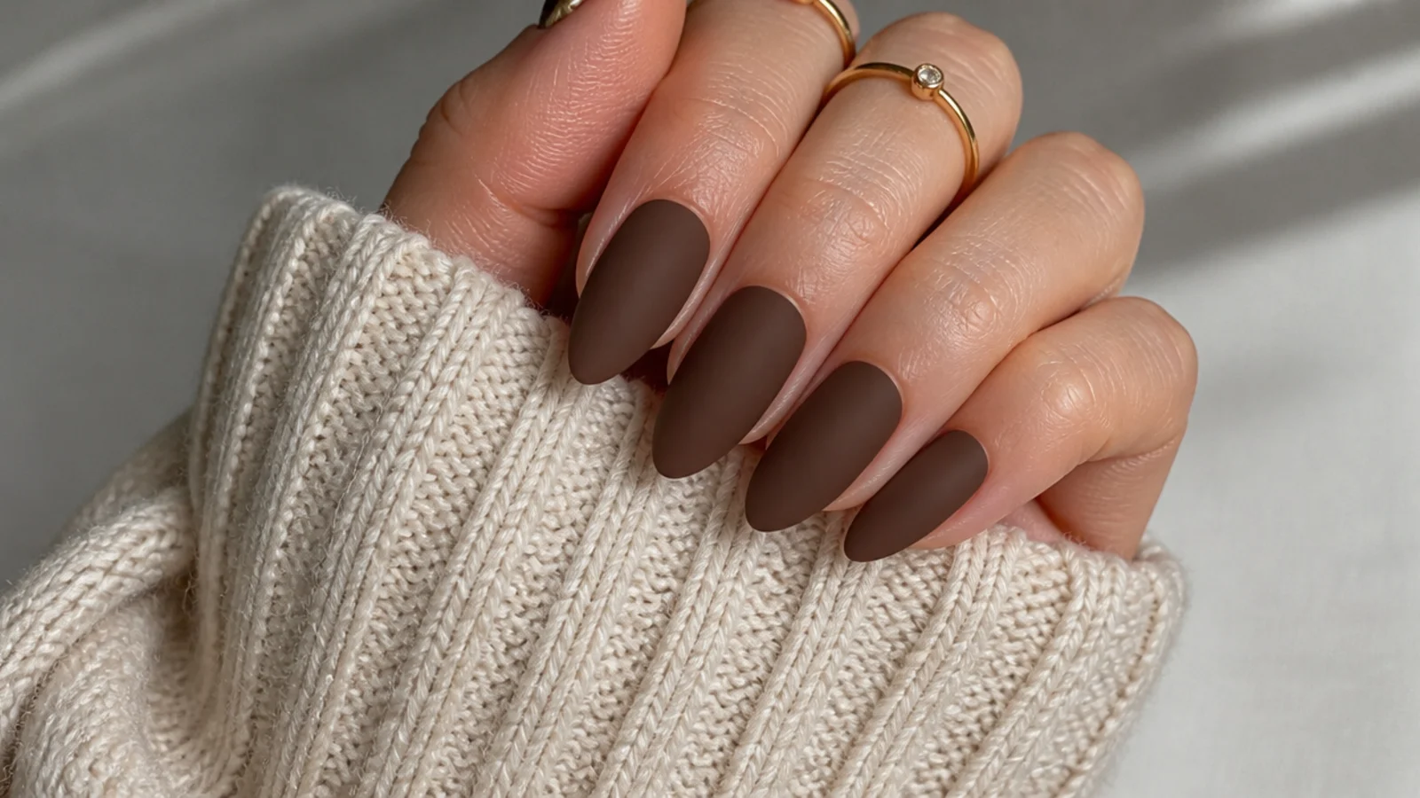 Warm matte cocoa brown almond nails with a suede finish