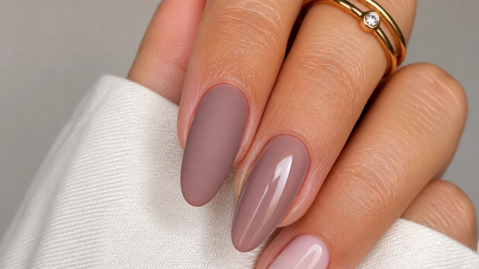 One matte nail beside one glossy nail in the same color for comparison