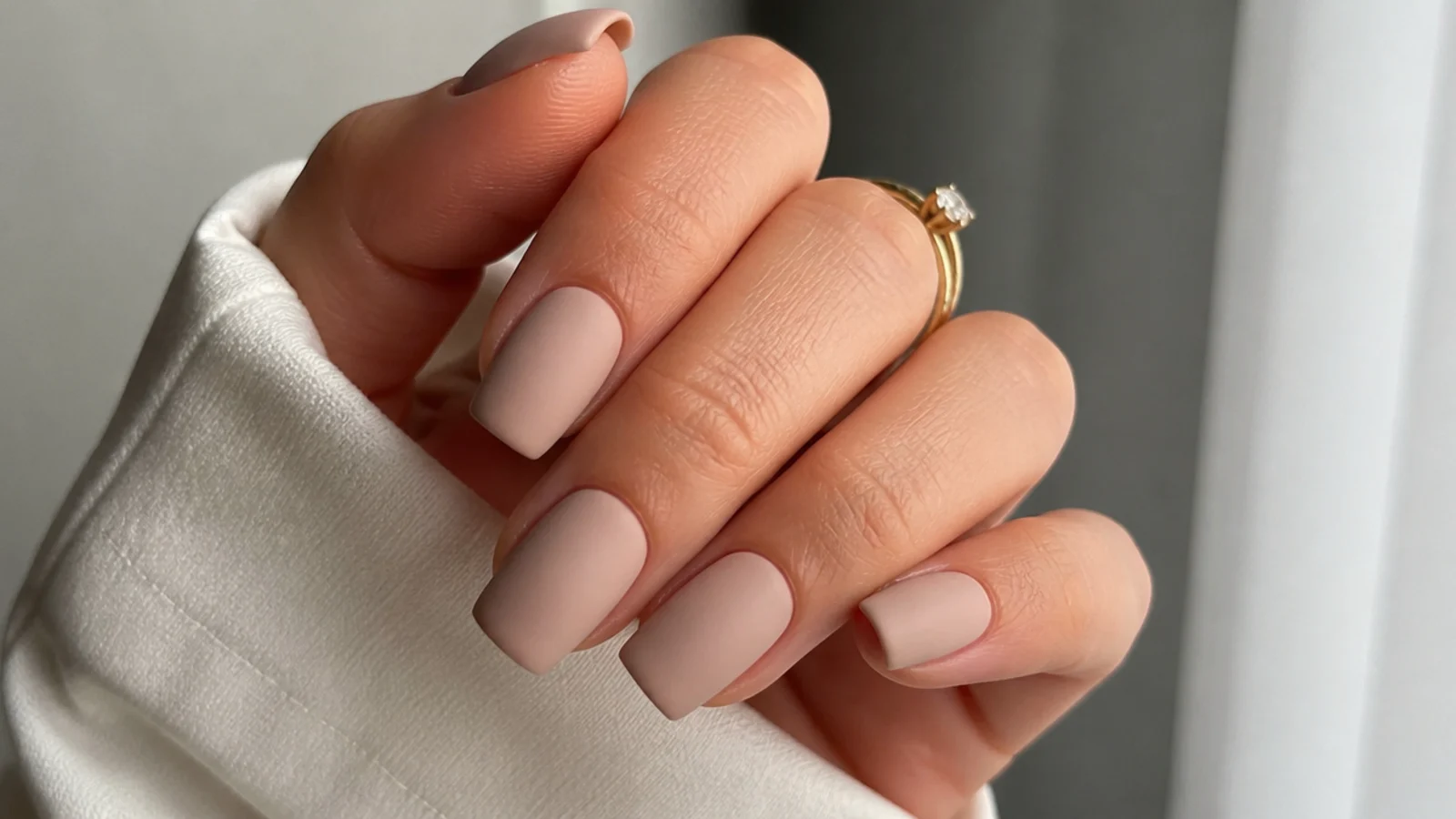 Soft matte nude beige nails on a squoval shape