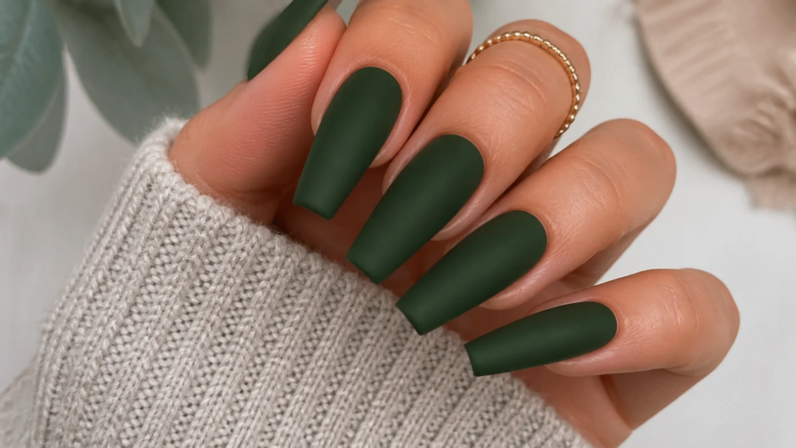 Deep matte forest green nails on a coffin shape