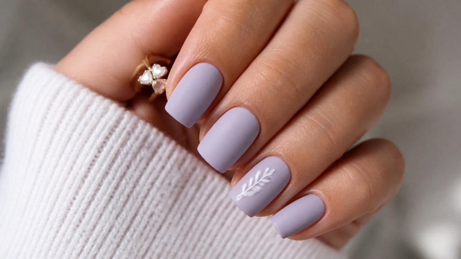 Soft matte pastel lilac nails on a squoval shape