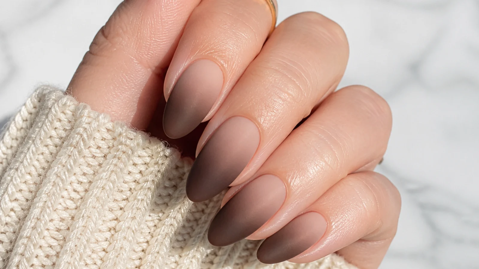 Matte ombre nails fading from nude to deep cocoa brown