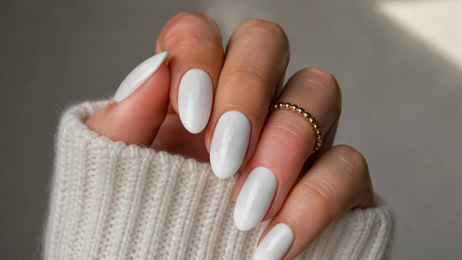 Matte white nails dulled with shiny patches from rich hand cream transfer
