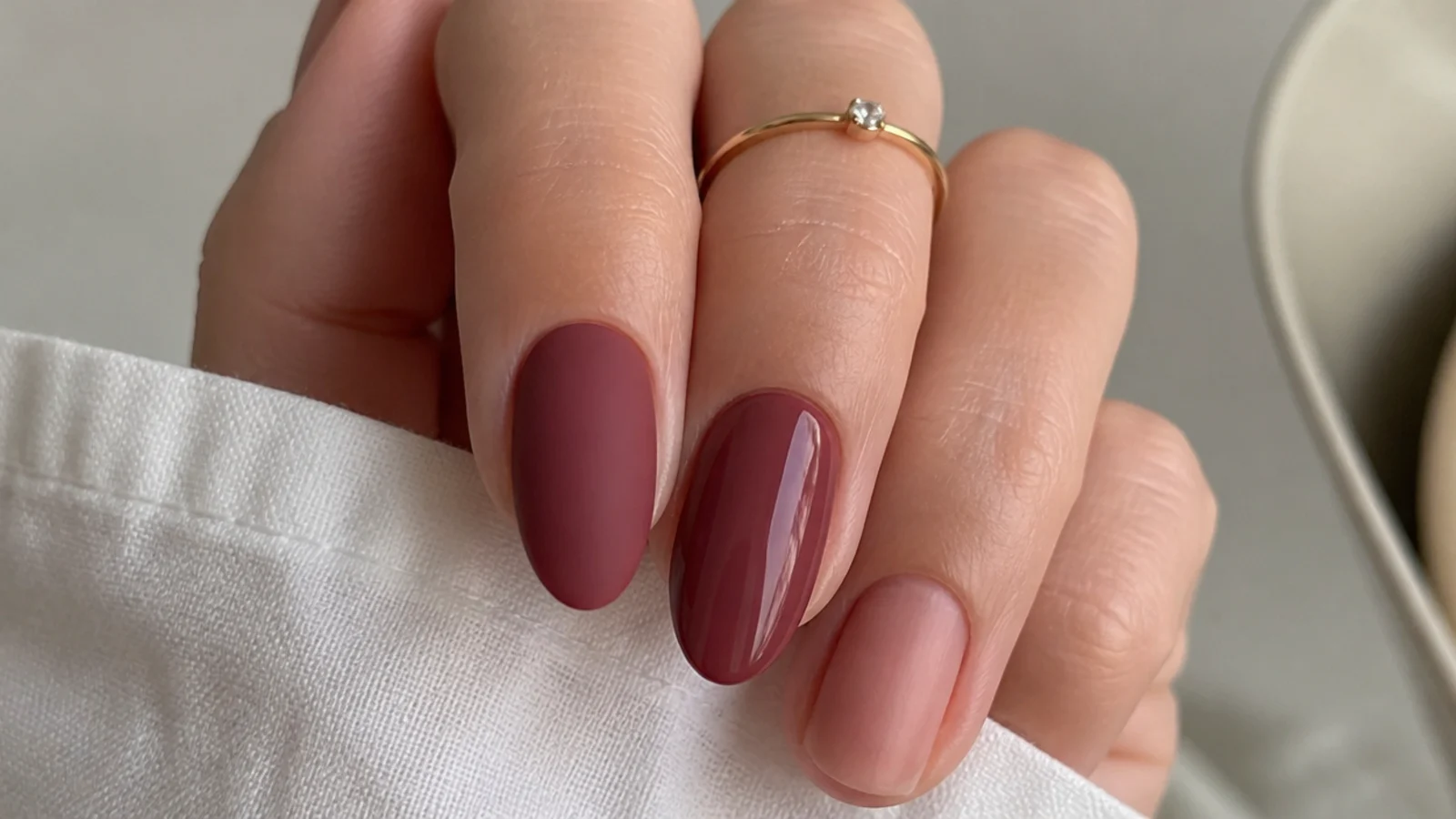 A matte nail beside a glossy nail in the same shade showing the finish difference
