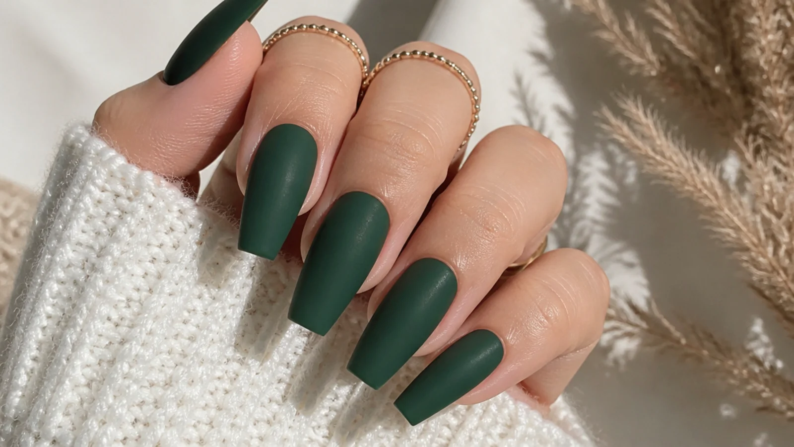 Deep matte forest green nails on a coffin shape with a flat finish