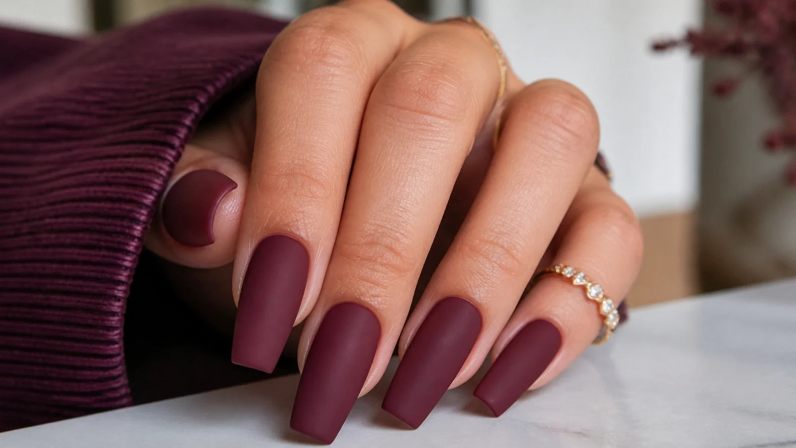 Deep matte burgundy wine nails on a coffin shape