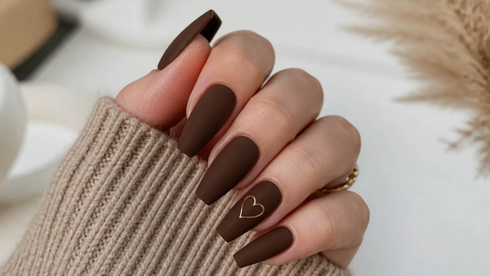 Rich matte cocoa brown nails on a coffin shape