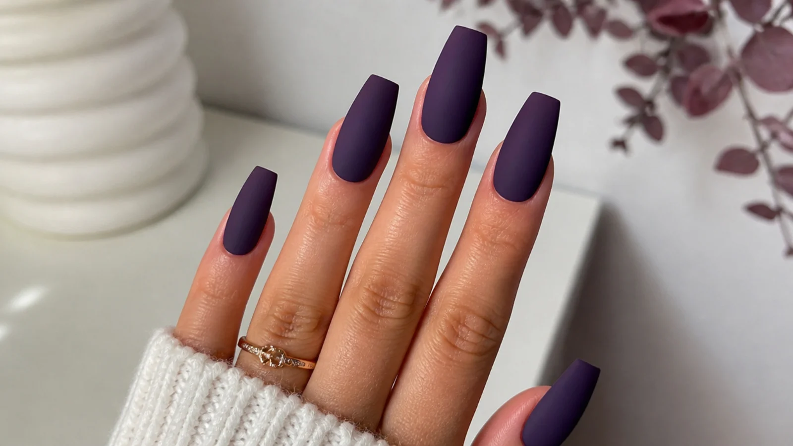 Deep matte plum purple nails on a coffin shape