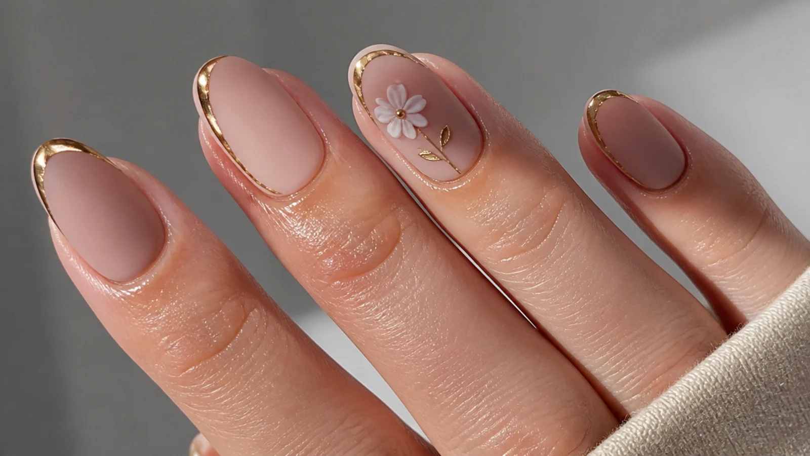 A well-sealed matte manicure with cuticle oil applied around the edges