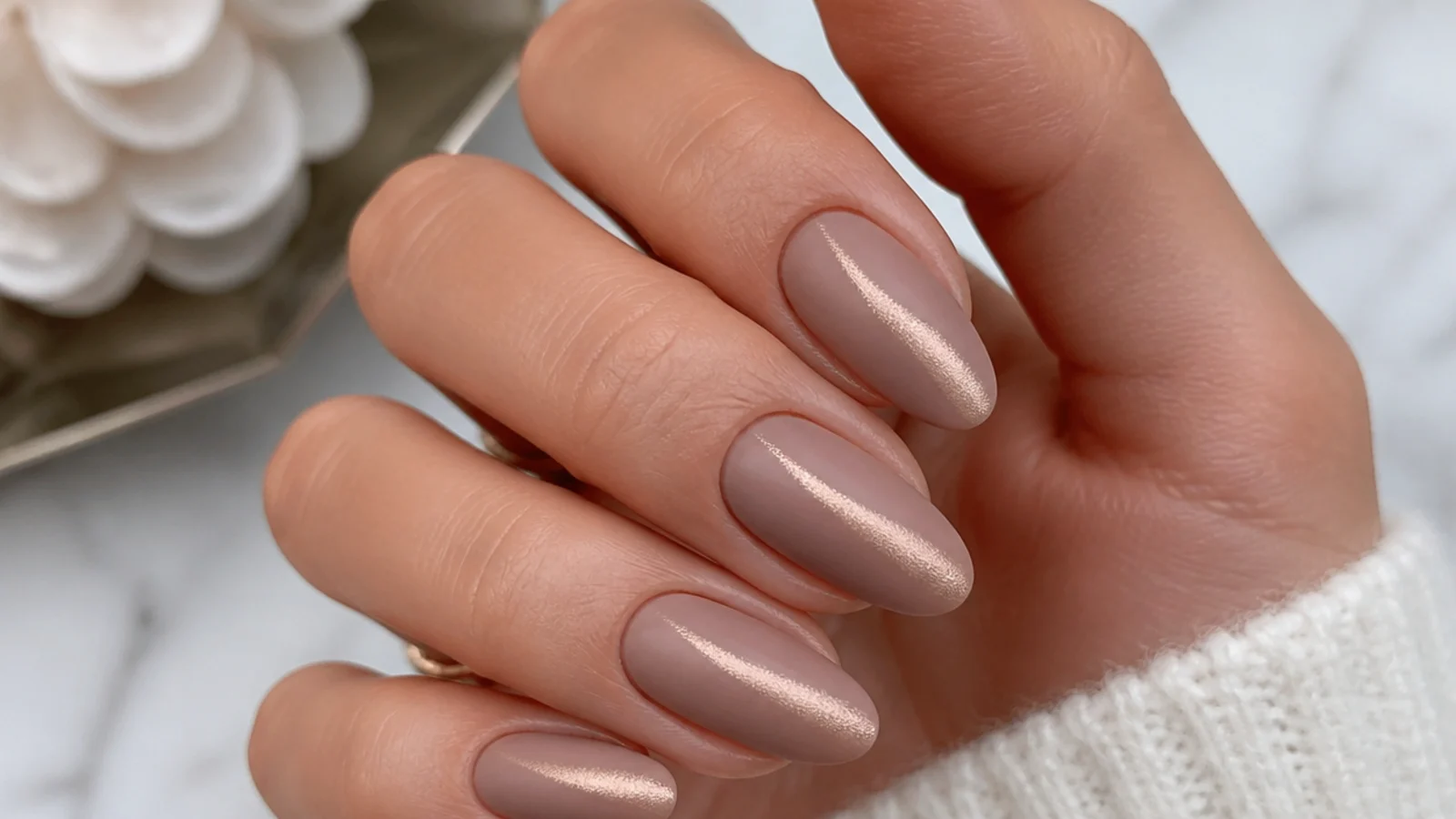 Matte nude nails with a soft magnetic cat-eye shimmer stripe