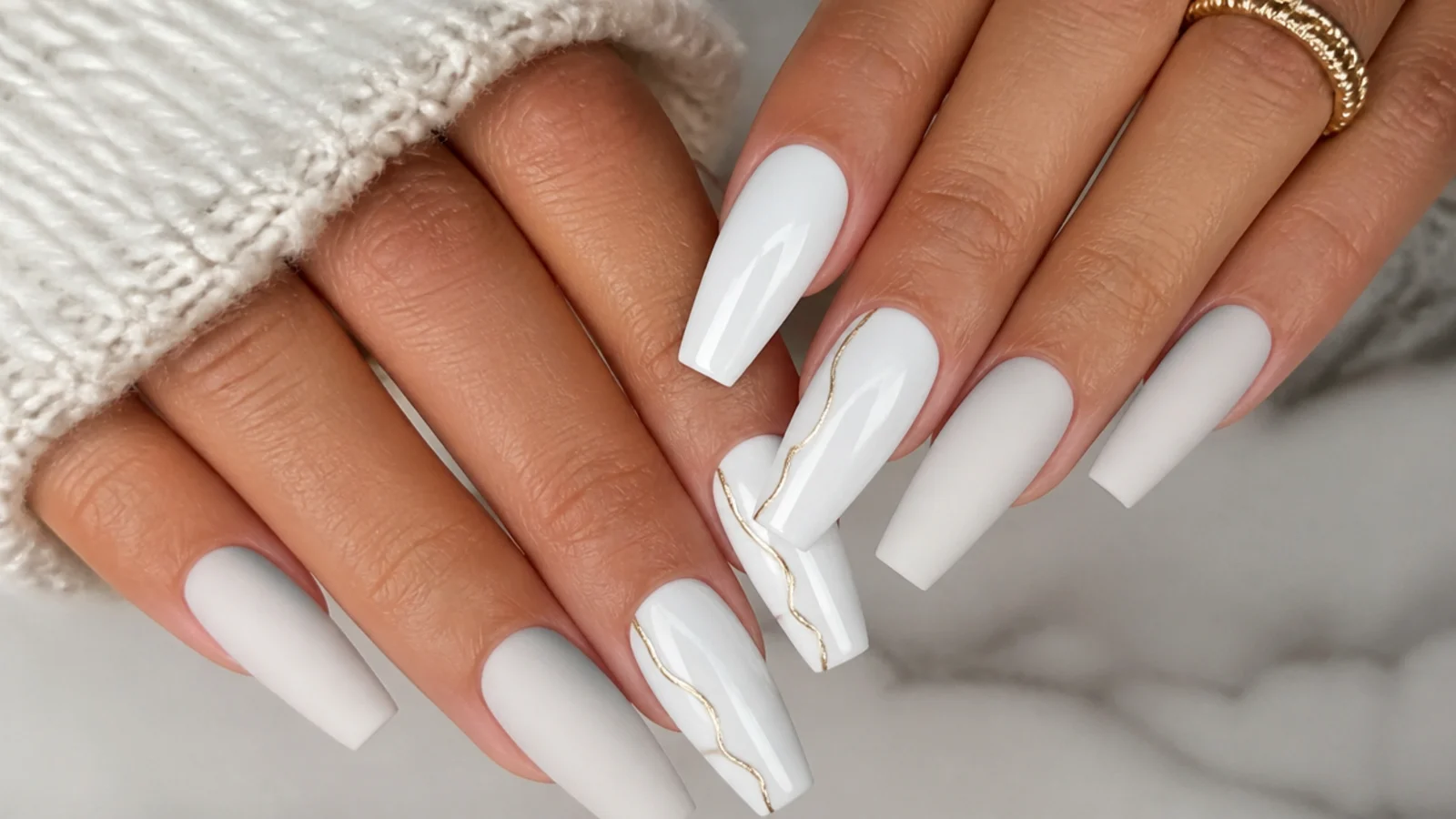Matte white nails beside glossy white nails on a coffin shape