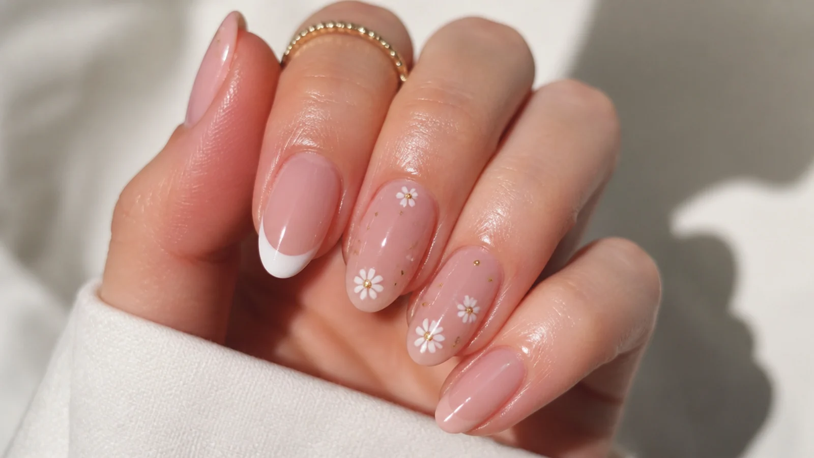Cuticle oil applied around the nail edges, not across a matte surface