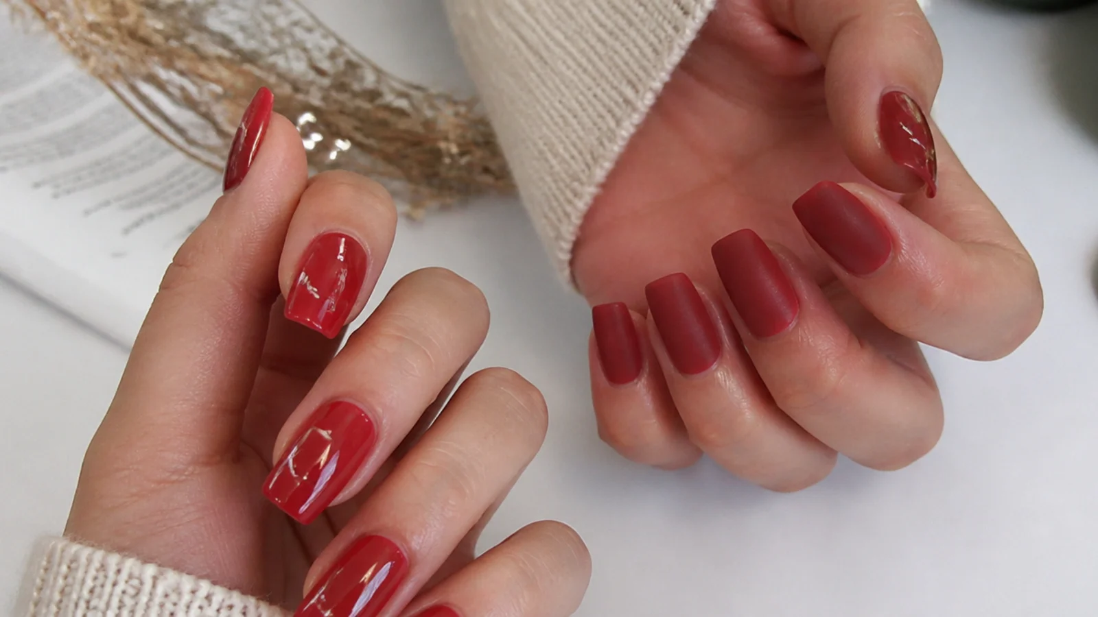 A matte red nail beside a glossy red nail for finish comparison