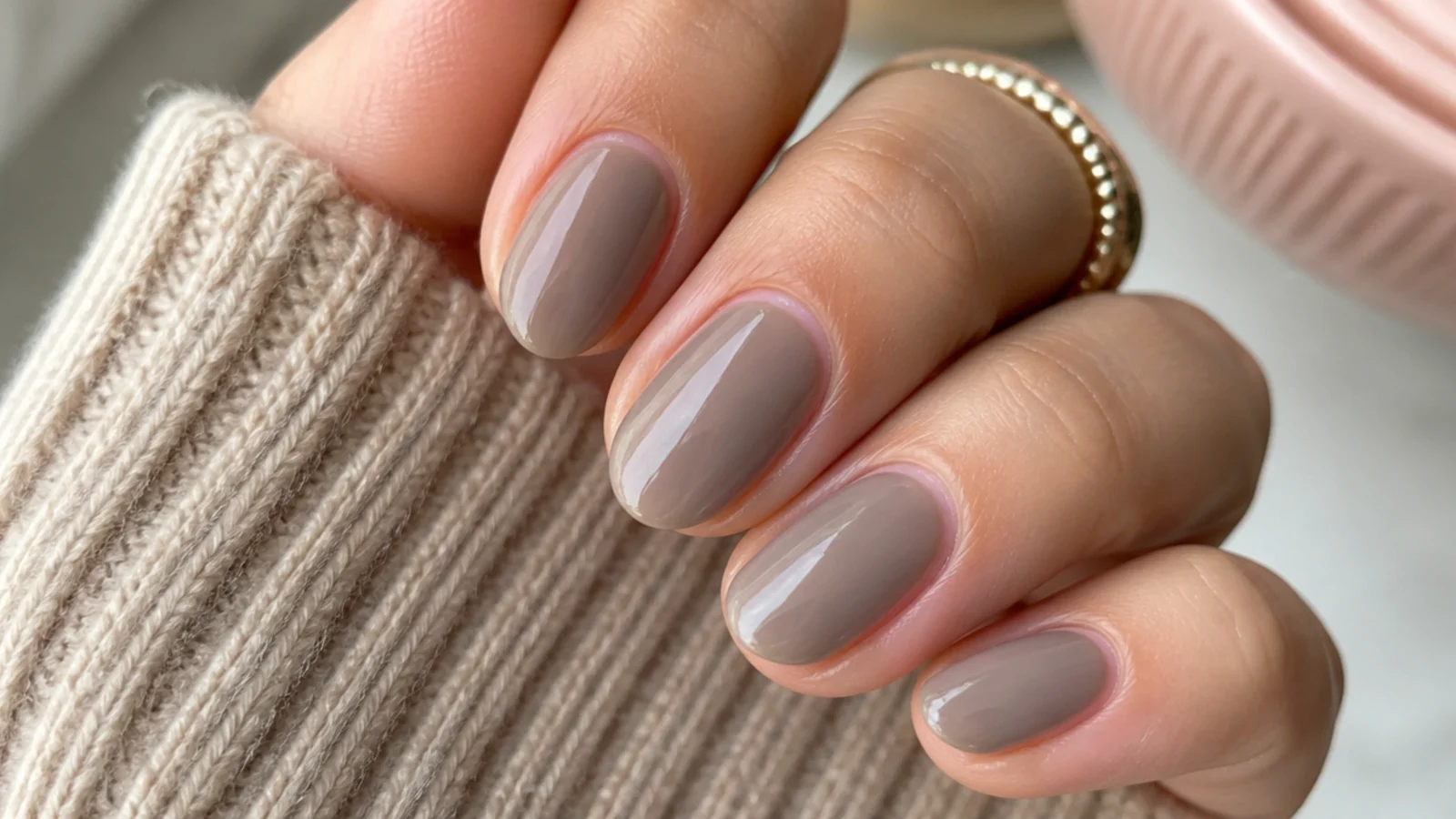 Short almond nails in milky brown with an iridescent pearl glazed donut sheen