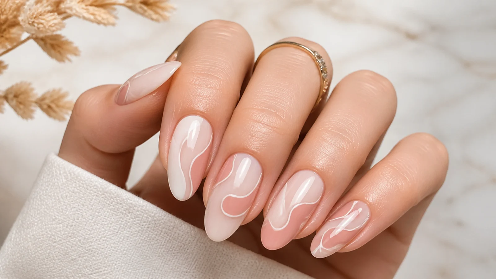 Almond abstract nails with freehand squiggles and color blocks over a milky base