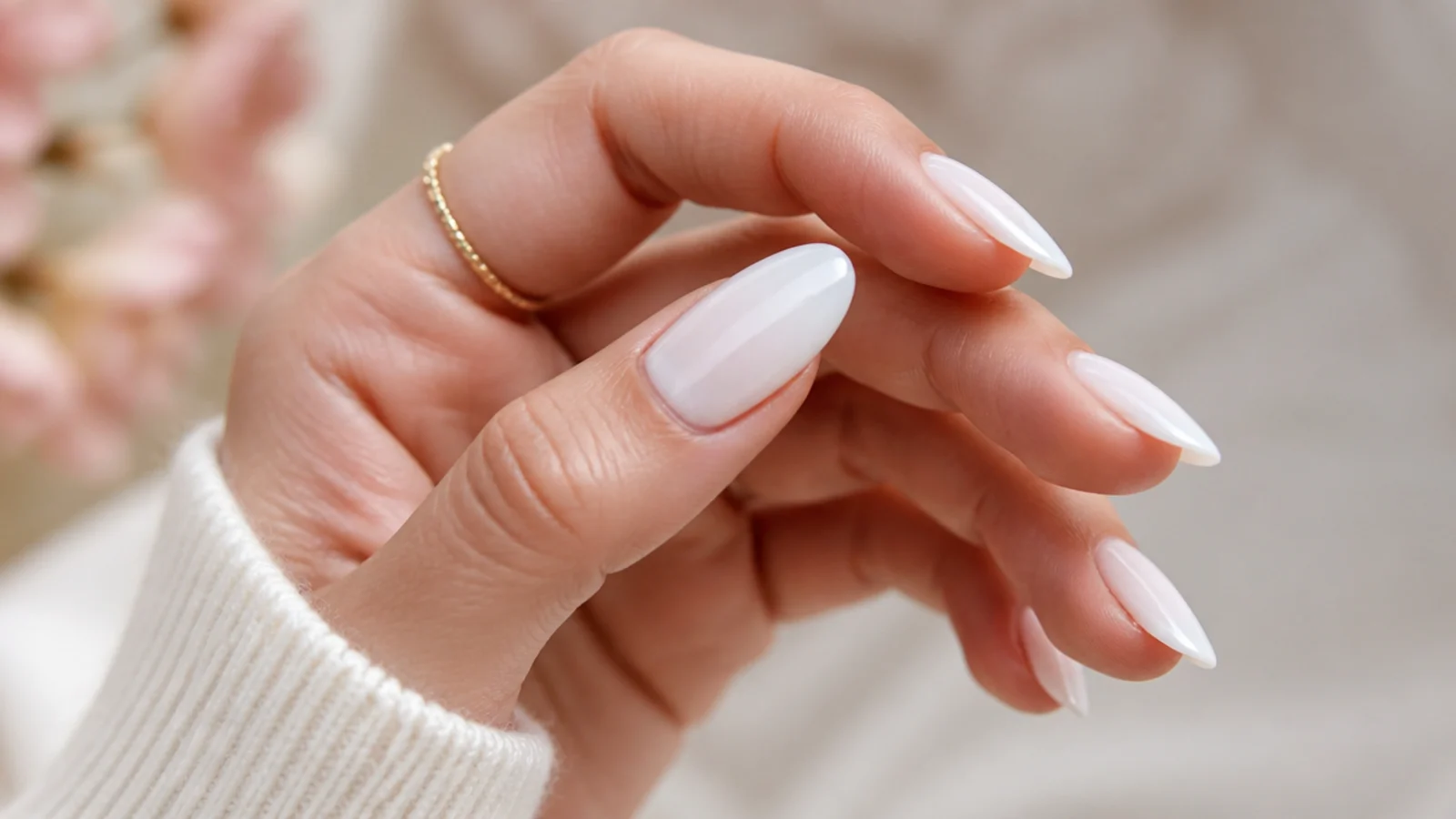 Almond nails in sheer milky white OPI Funny Bunny with a soft cloudy finish