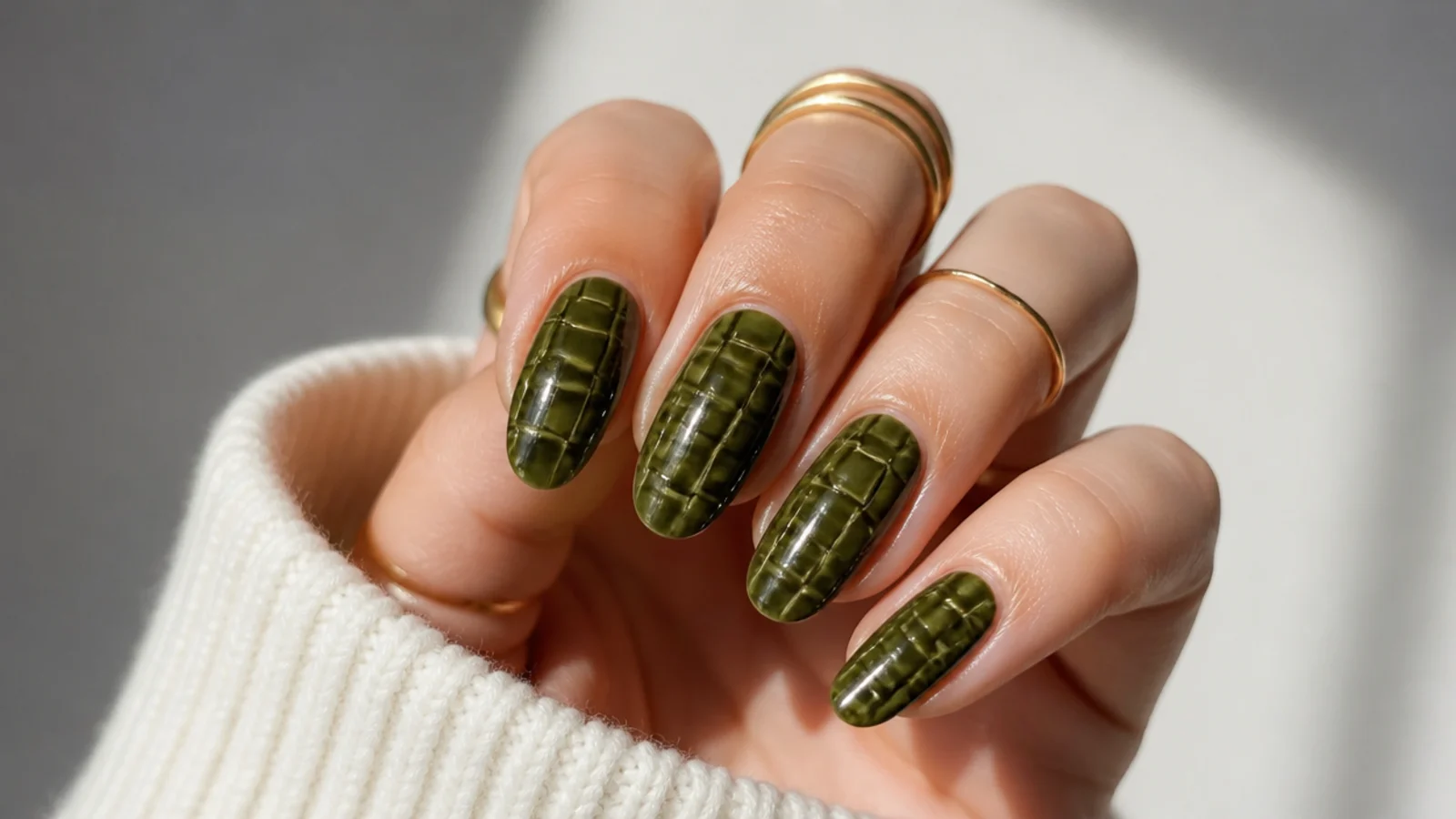 Dark olive green nails with a tonal crocodile texture pattern