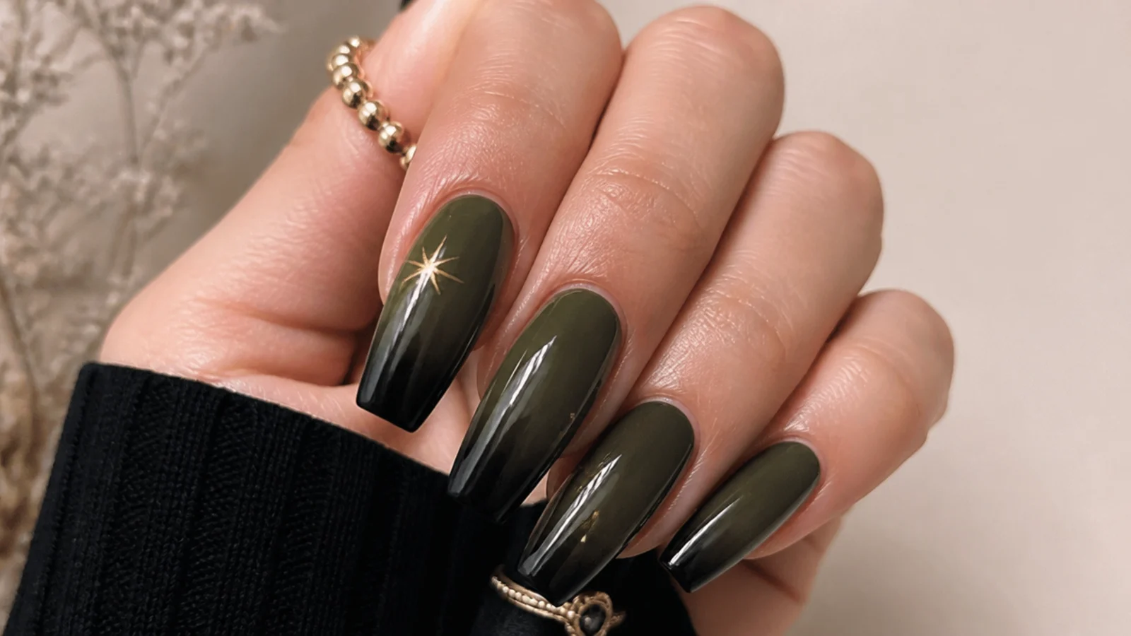 Dark olive green fading to black ombre nails on coffin shape