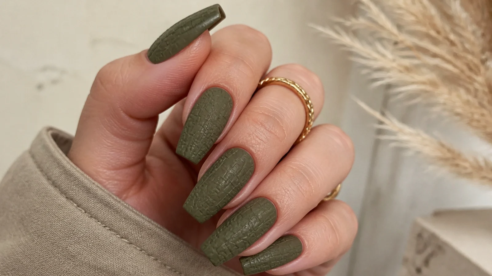 Matte olive green acrylic nails with a subtle croc skin texture