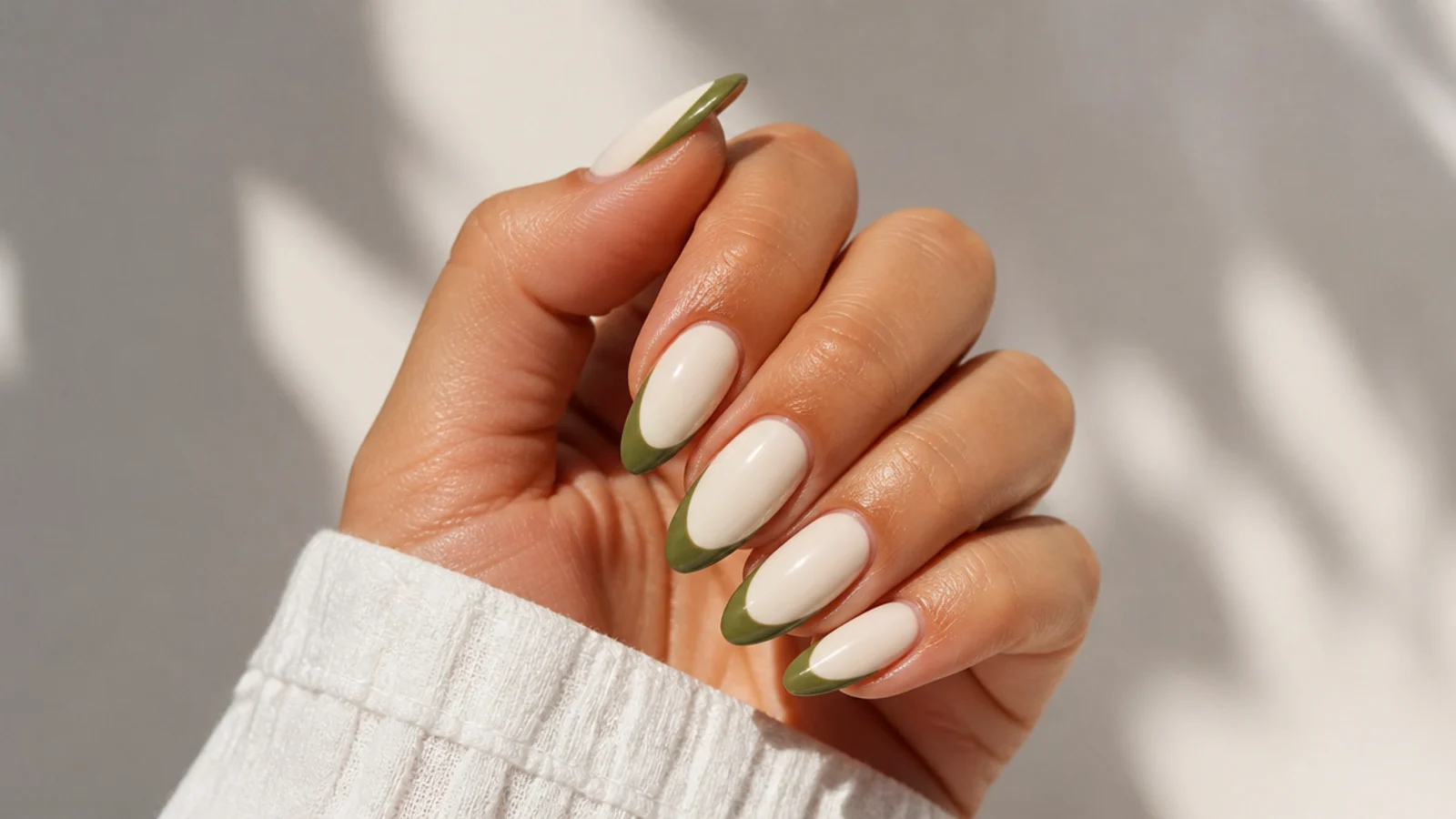 Cream almond nails with warm olive green french tips