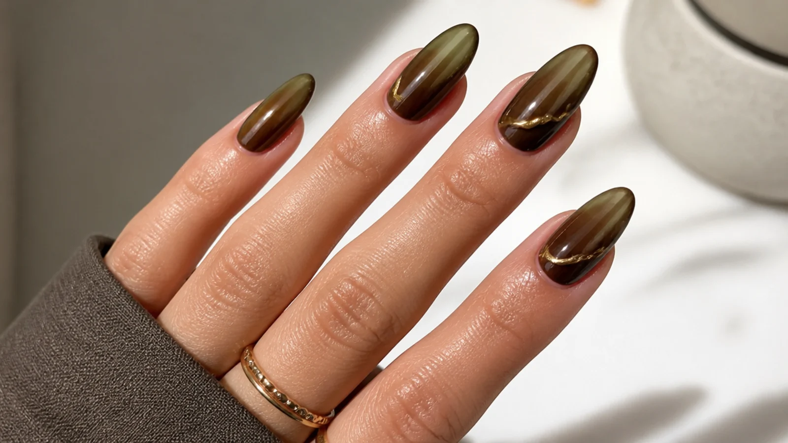 Warm olive to brown ombre almond nails