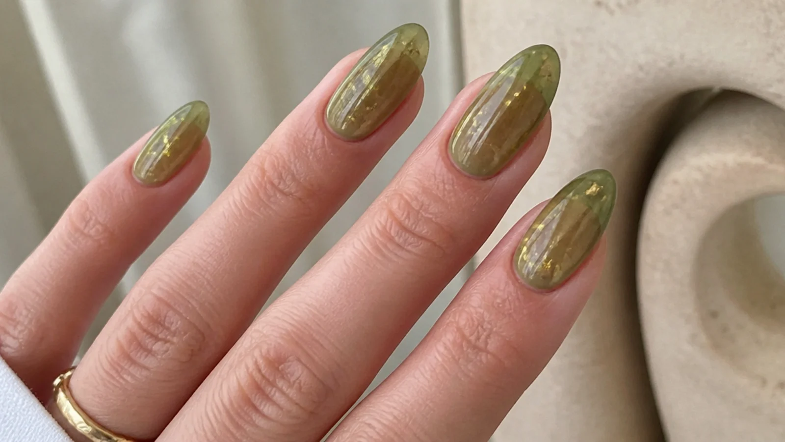 Sheer jelly olive green nails suspended with gold flakes
