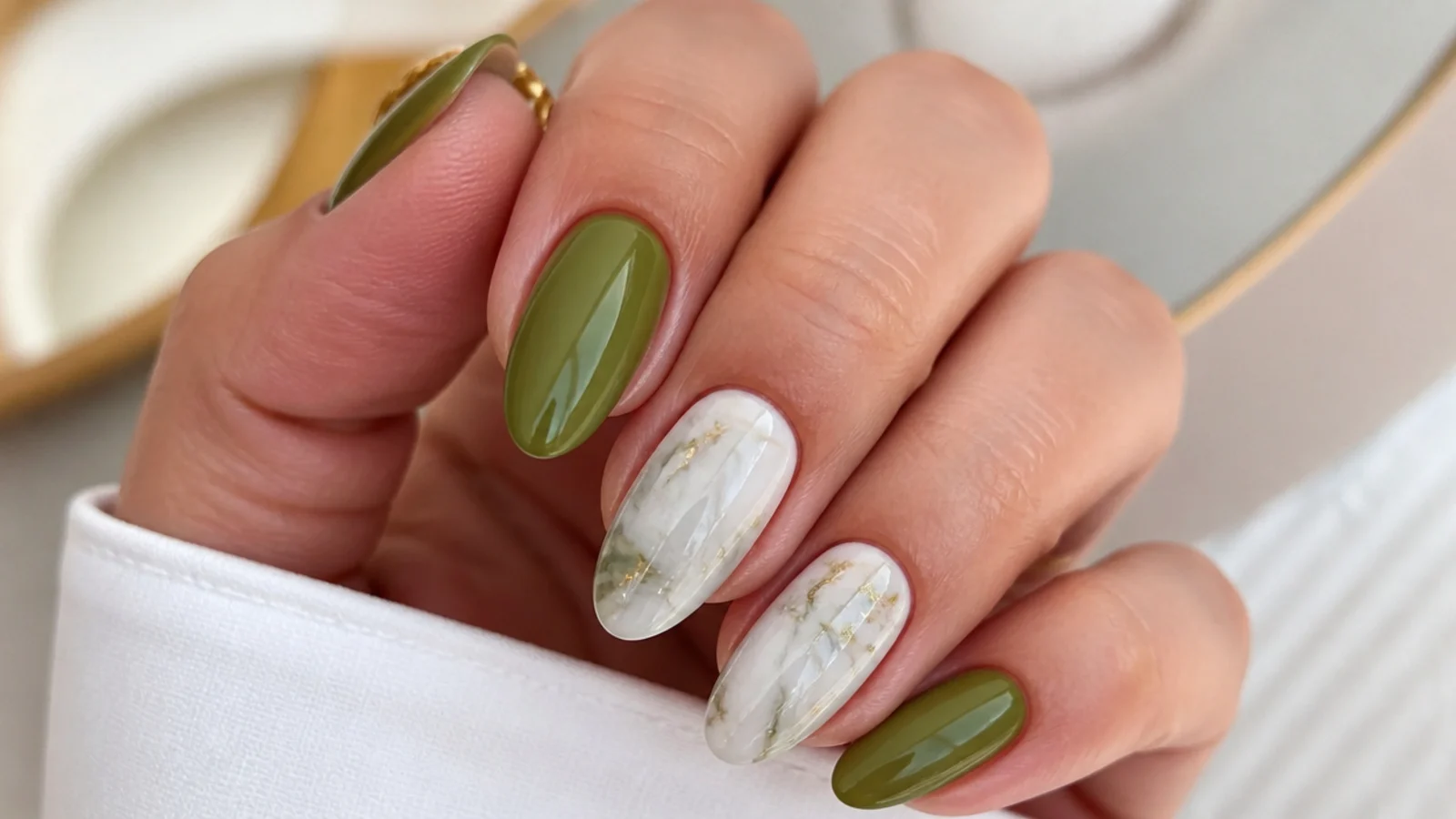 Olive green and white marble nails with soft hazy veining