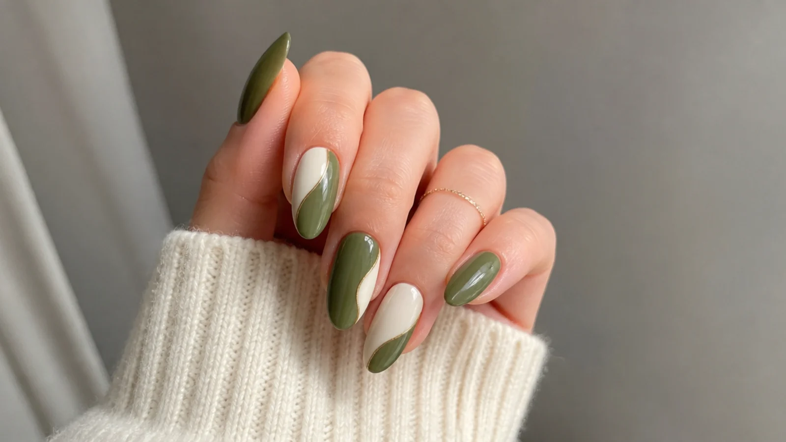 Olive green and cream color-blocked nails alternating across the hand