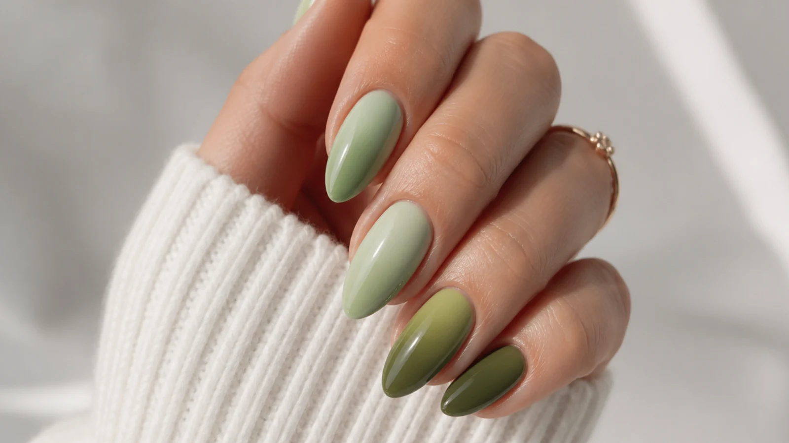 Olive green ombre nails fading from light to dark across the hand