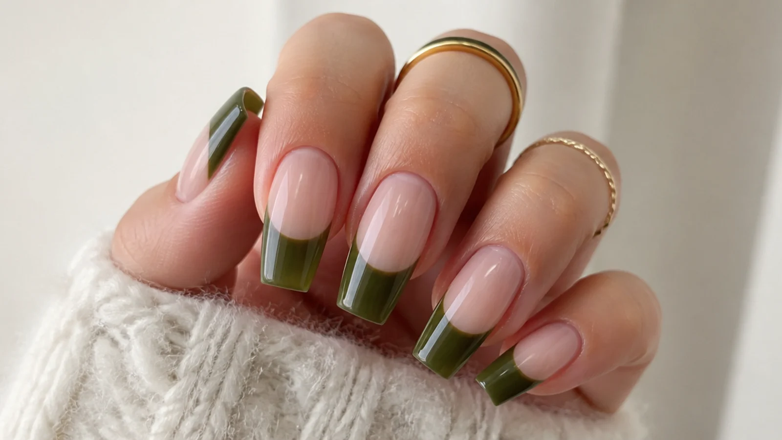 Wide olive green french tips covering the top third of coffin nails