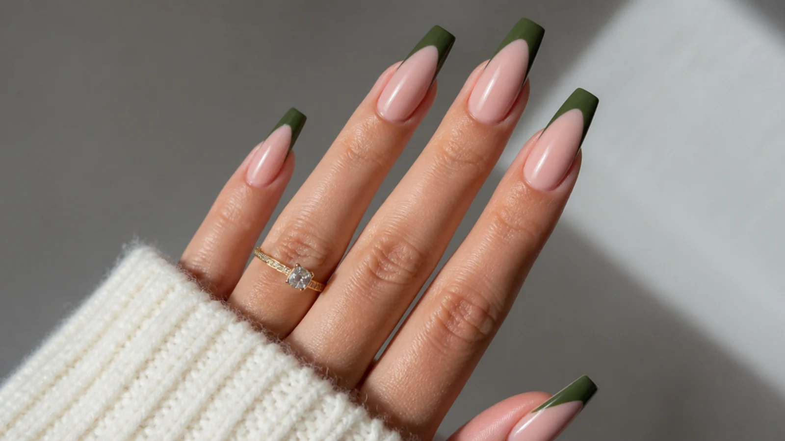Deep olive green french tips on a long coffin shape over nude