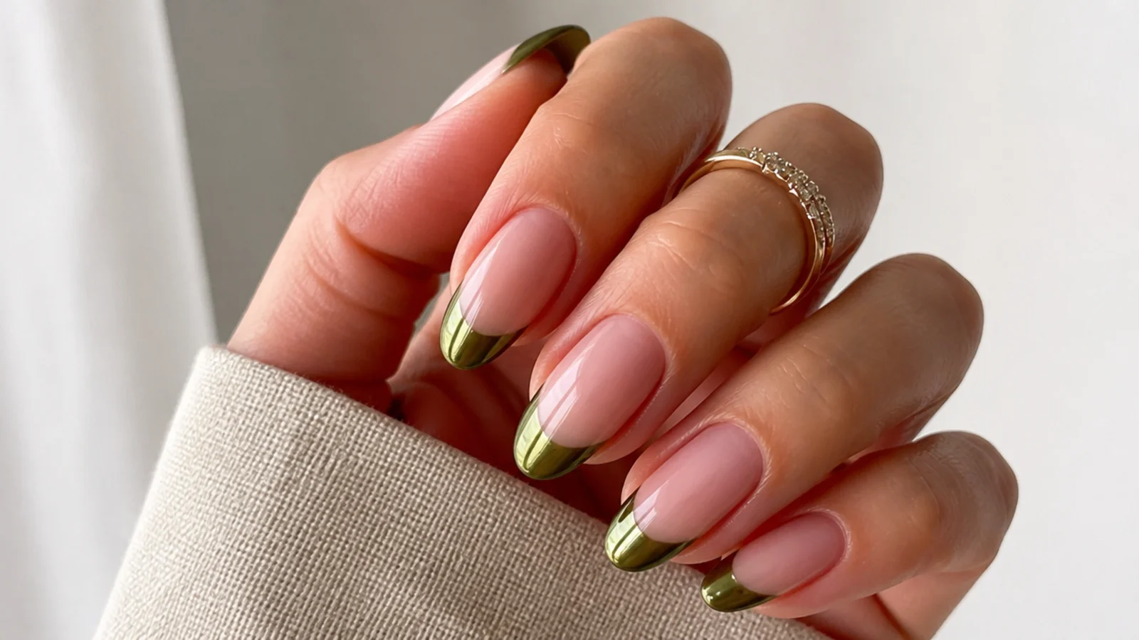 Nude nails with a mirror olive chrome french tip