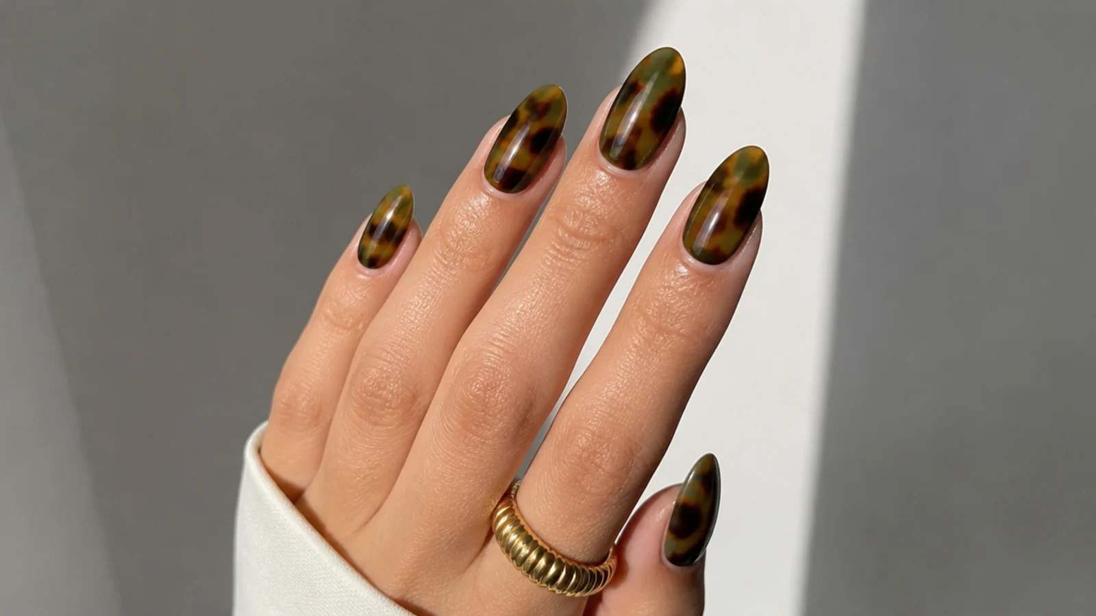 Olive green tortoiseshell nails with amber and brown mottling