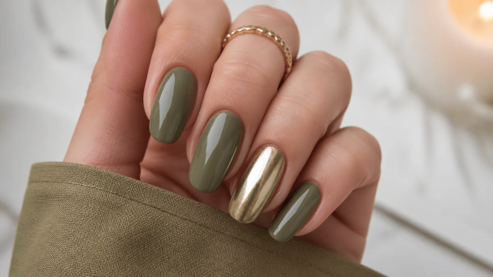 Muted olive green nails with one solid gold metallic accent nail