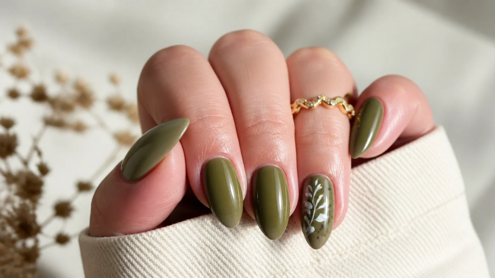 Glossy warm olive green nails on a medium almond shape